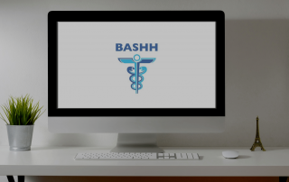 A computer screen with the BASHH logo