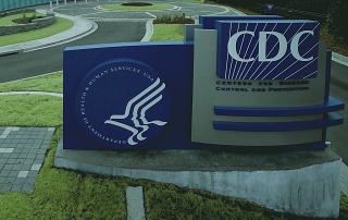 CDC sign in front of office building